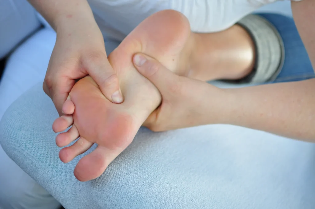 adult receiving foot massage indoors at daytime 2026 01 06 09 22 56 utc