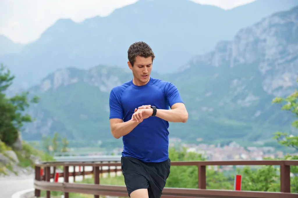 italy trentino man running on road near lake gar