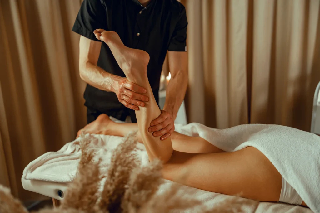 professional masseur man doing leg massage for fem 2026 01 05 06 04 55 utc