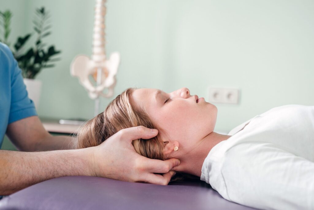 woman receiving neck massage at doctor s office 2026 01 05 01 00 36 utc