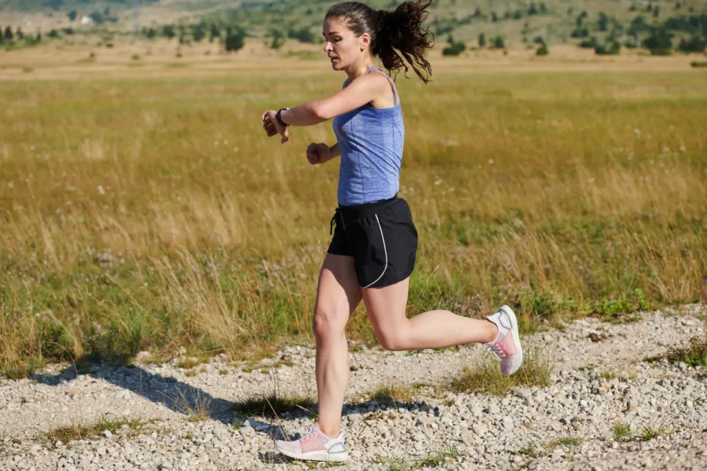 woman-runs-on-a-path-through-a-field